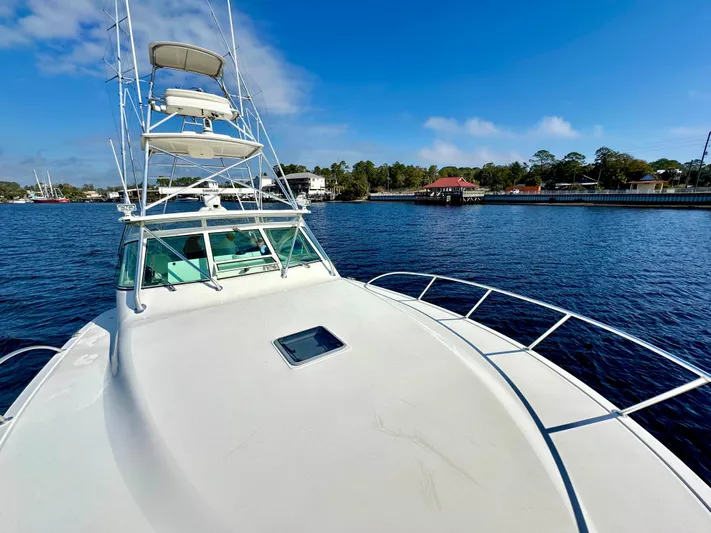 Steamer Yacht Photos Pics 2008 Albemarle 410 Express Fisherman boat on calm water, clear sky, and distant shoreline.