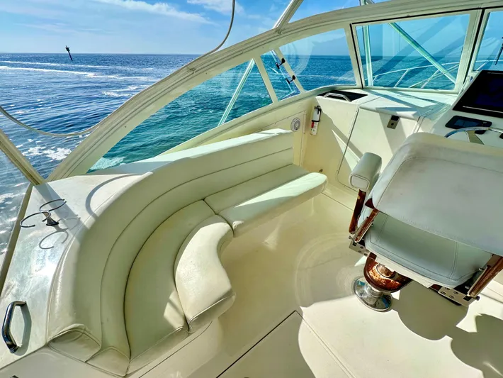 Steamer Yacht Photos Pics 2008 Albemarle 410 Express Fisherman interior with ocean view, featuring white seating and helm.