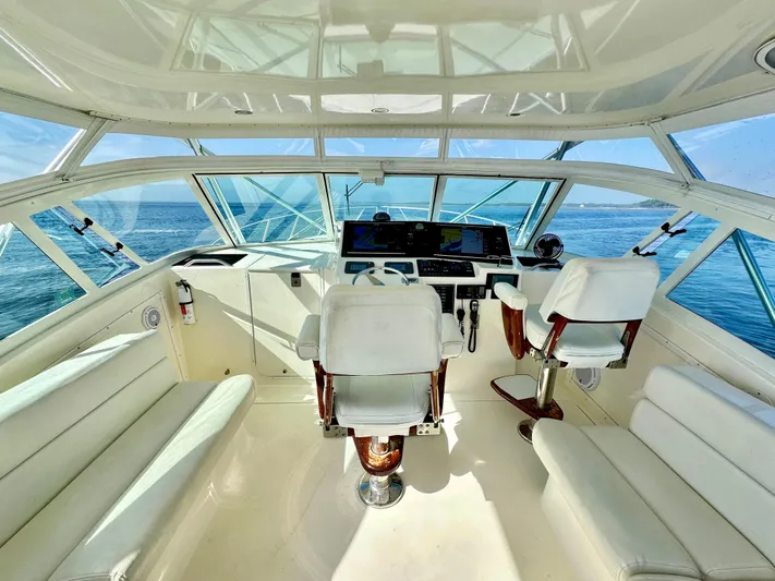 Steamer Yacht Photos Pics 2008 Albemarle 410 Express Fisherman helm with ocean view, featuring white seating and controls.