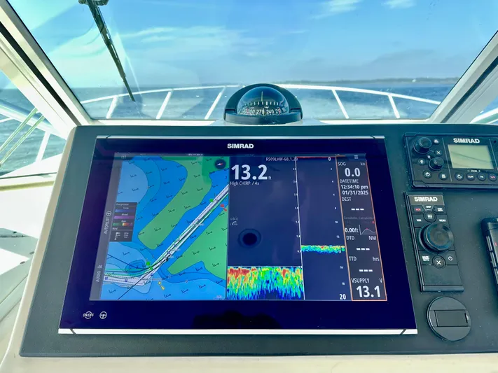 Steamer Yacht Photos Pics Navigation system on 2008 Albemarle 410 Express Fisherman boat, displaying marine charts and data.