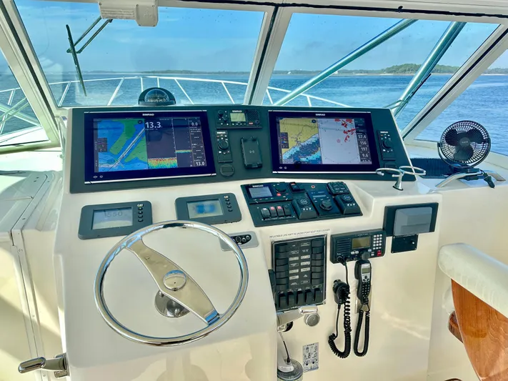 Steamer Yacht Photos Pics Helm of 2008 Albemarle 410 Express Fisherman with navigation screens and controls.