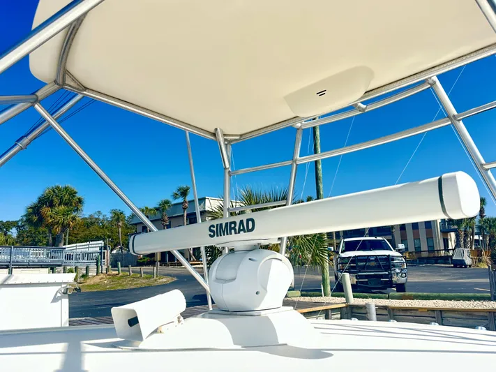 Steamer Yacht Photos Pics Radar equipment on 2008 Albemarle 410 Express Fisherman boat under clear blue sky.