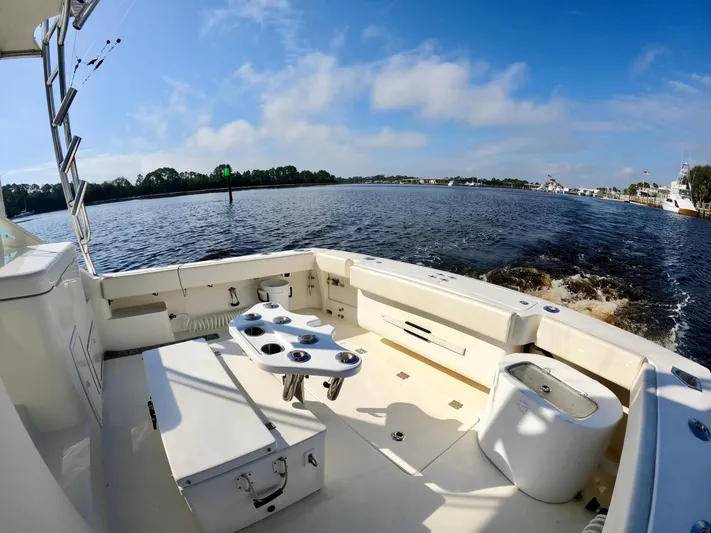 Steamer Yacht Photos Pics 2008 Albemarle 410 Express Fisherman boat, spacious deck, scenic water view, clear blue sky.