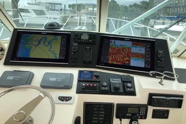 Steamer Yacht Photos Pics Control panel of 2008 Albemarle 410 Express Fisherman with navigation screens and instruments.