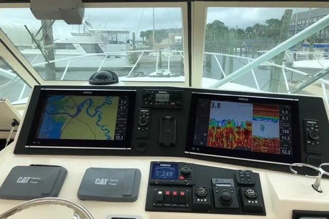 Steamer Yacht Photos Pics Control panel of 2008 Albemarle 410 Express Fisherman with navigation and sonar displays.