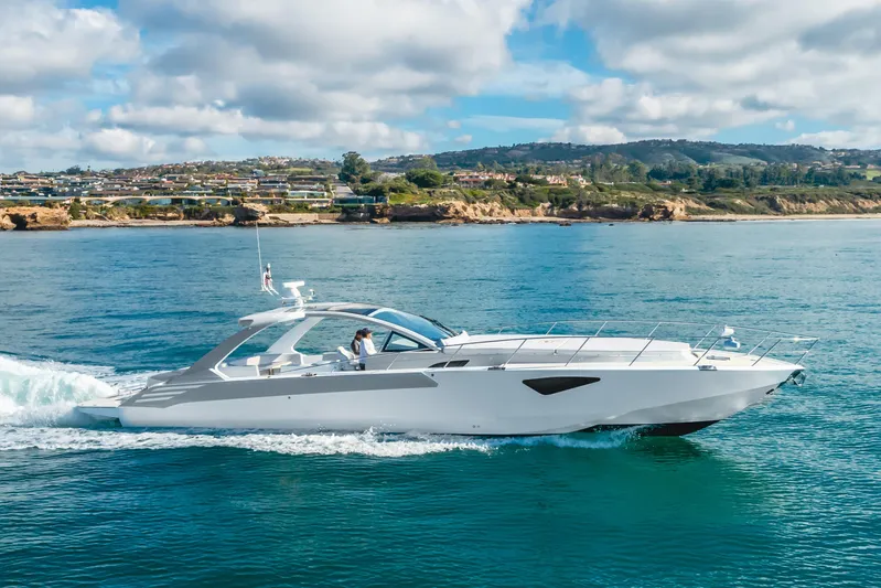 Catch & Release Yacht Photos Pics Luxurious 2017 Custom 60 yacht cruising on serene blue waters near a scenic coastline.