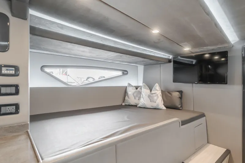 Catch & Release Yacht Photos Pics Luxurious interior of a 2017 Custom 60 yacht with modern seating and TV.