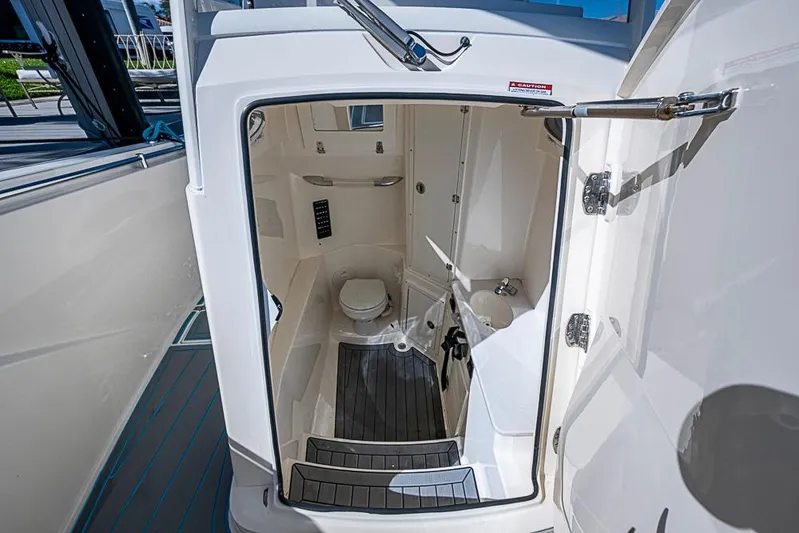 Livy Rose Yacht Photos Pics 2021 Cobia 320 Center Console boat interior with compact bathroom amenities.