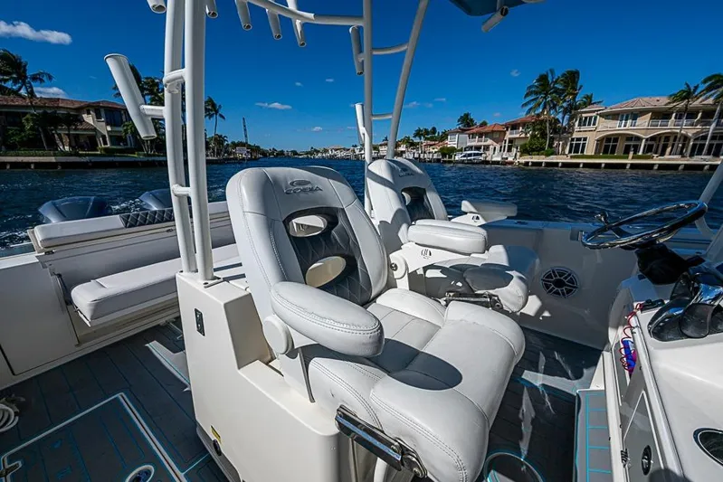 Livy Rose Yacht Photos Pics 2021 Cobia 320 Center Console boat interior with luxurious seating and waterfront view.
