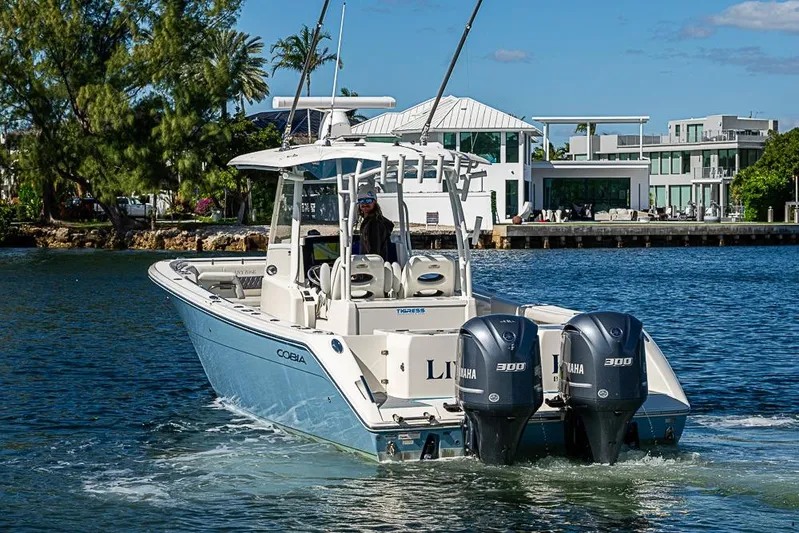 Livy Rose Yacht Photos Pics 2021 Cobia 320 Center Console boat with twin Yamaha engines on the water.