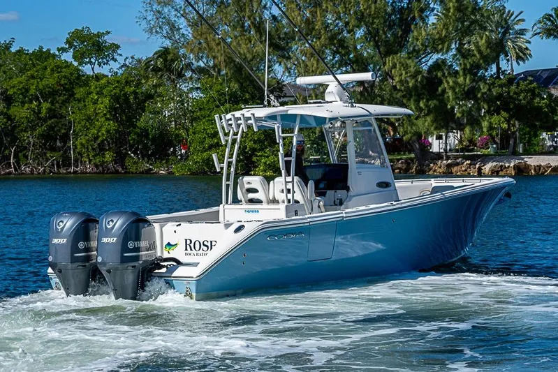 Livy Rose Yacht Photos Pics 2021 Cobia 320 Center Console boat cruising on a scenic waterway.