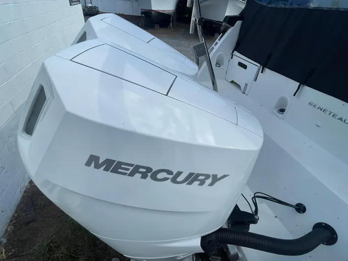  Yacht Photos Pics 2024 Beneteau Gran Turismo 32 with dual Mercury outboard engines, docked outdoors.