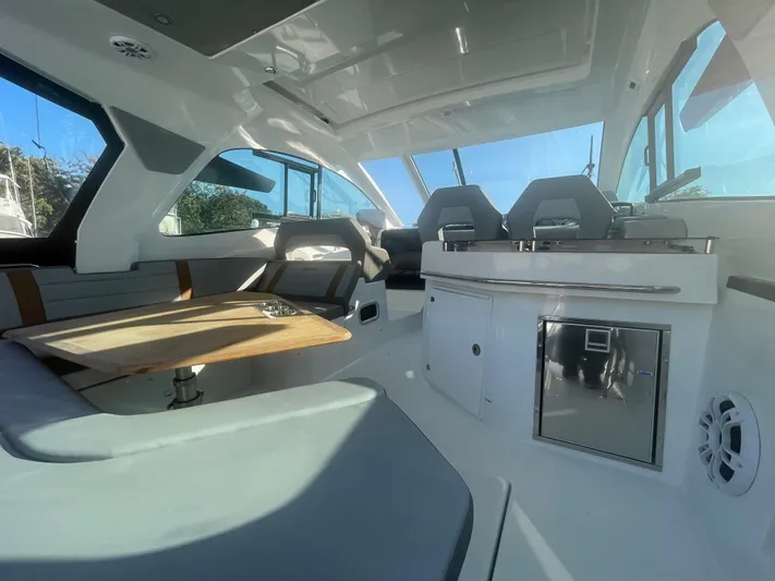  Yacht Photos Pics 2024 Beneteau Gran Turismo 32 interior with seating, table, and modern amenities.