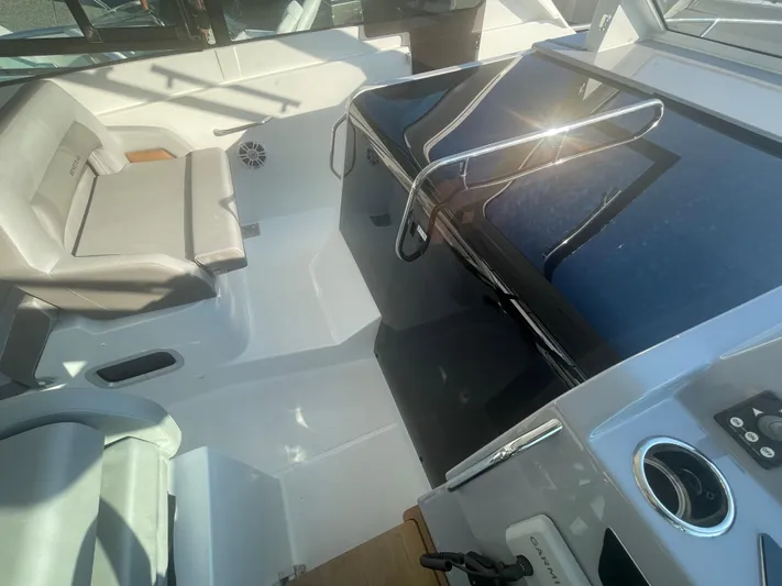  Yacht Photos Pics 2024 Beneteau Gran Turismo 32 cockpit with modern seating and sleek dashboard design.