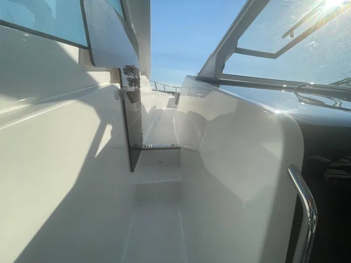  Yacht Photos Pics 2024 Beneteau Gran Turismo 32 yacht deck with sleek design and open windows.
