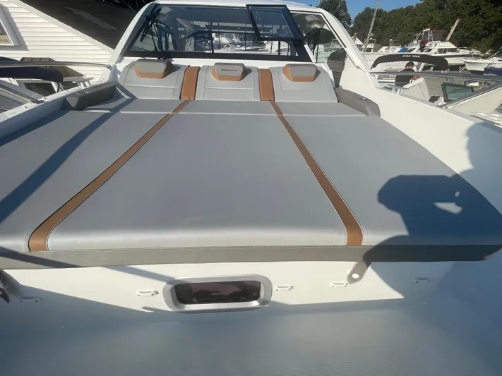  Yacht Photos Pics 2024 Beneteau Gran Turismo 32 boat with sleek gray and brown seating.