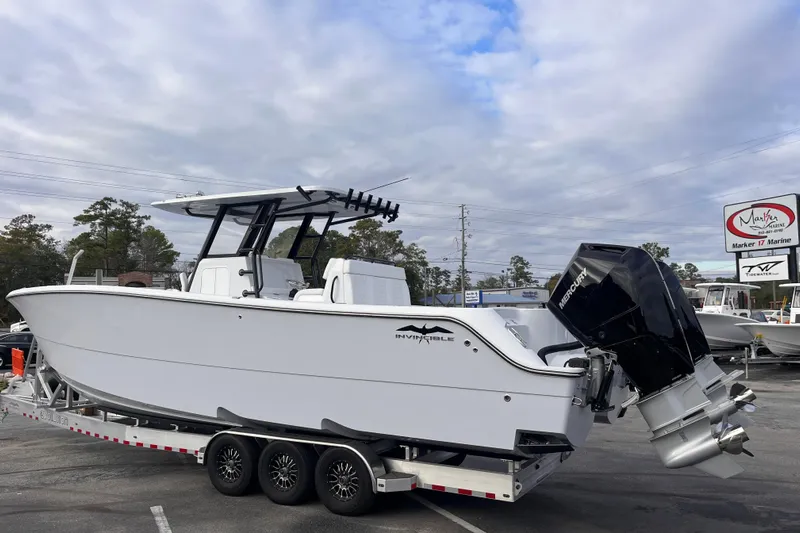  Yacht Photos Pics 2026 Invincible 33 Catamaran on trailer, featuring dual Mercury outboard engines.