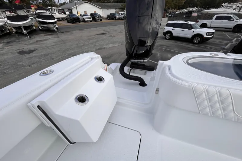  Yacht Photos Pics 2026 Invincible 33 Catamaran boat deck with engine and seating area.