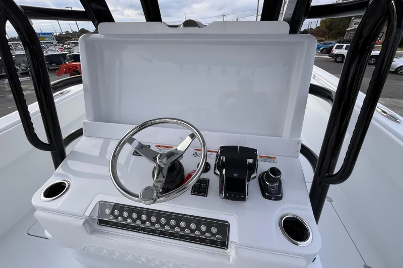  Yacht Photos Pics 2026 Invincible 33 Catamaran helm with steering wheel and controls.