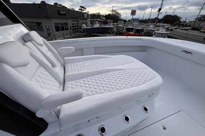  Yacht Photos Pics 2026 Invincible 33 Catamaran with luxurious white seating and modern design.