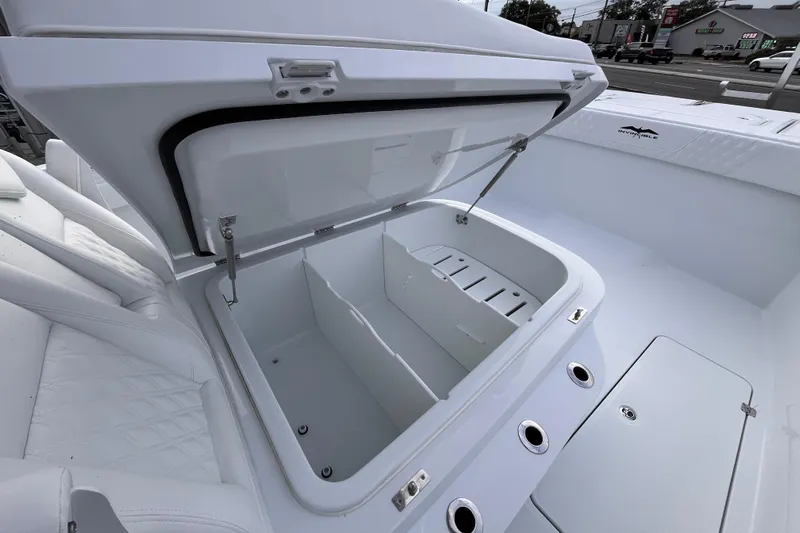  Yacht Photos Pics Open storage compartment on 2026 Invincible 33 Catamaran, showcasing spacious interior design.