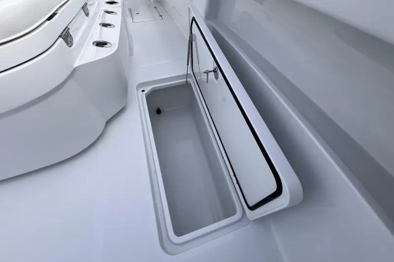  Yacht Photos Pics 2026 Invincible 33 Catamaran storage compartment with open hatch, showcasing sleek design.