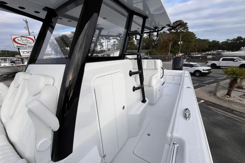  Yacht Photos Pics 2026 Invincible 33 Catamaran with sleek white interior and modern design features.