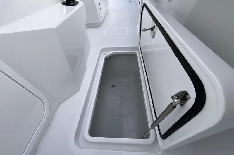  Yacht Photos Pics Open storage compartment on 2026 Invincible 33 Catamaran, showcasing sleek design and functionality.