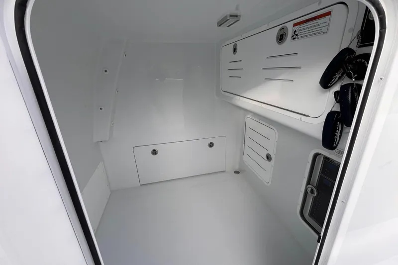  Yacht Photos Pics Interior of 2026 Invincible 33 Catamaran, featuring storage compartments and sleek design.