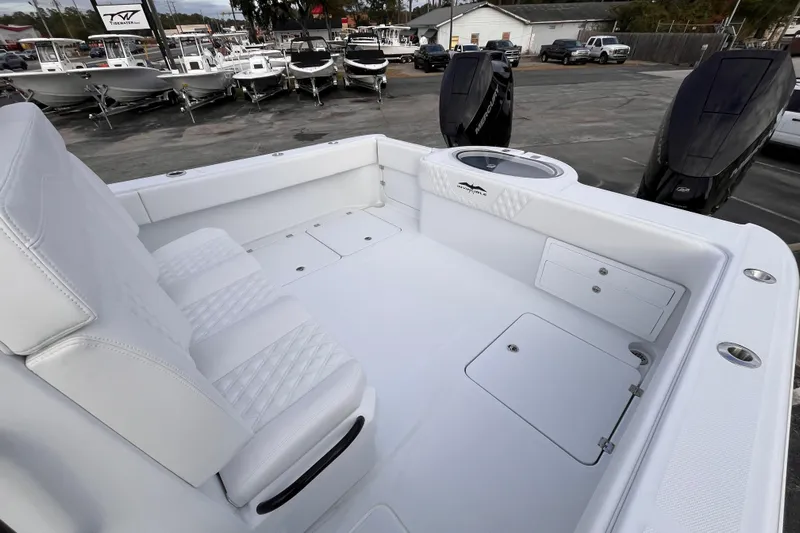  Yacht Photos Pics 2026 Invincible 33 Catamaran with white seating and dual Mercury outboard engines.