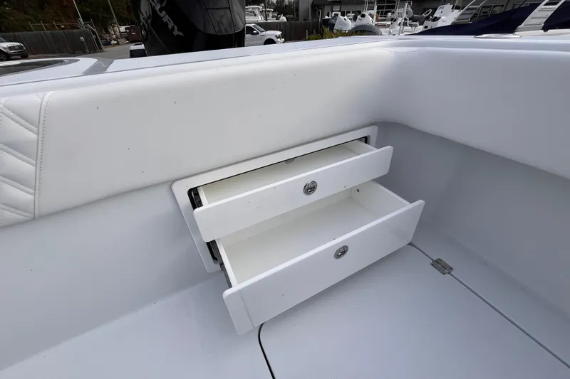  Yacht Photos Pics Open storage drawers on a 2026 Invincible 33 Catamaran boat interior.
