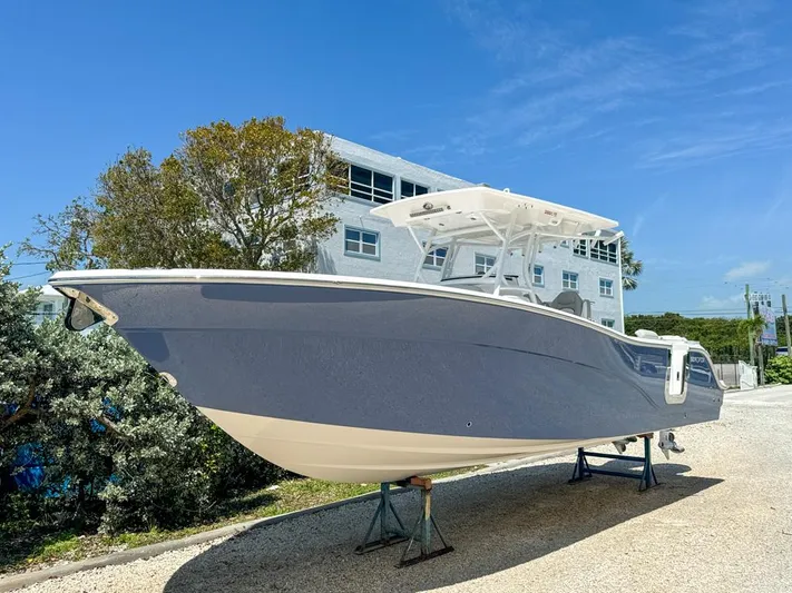  Yacht Photos Pics 2024 Sea Fox 288 Commander boat on display outdoors.