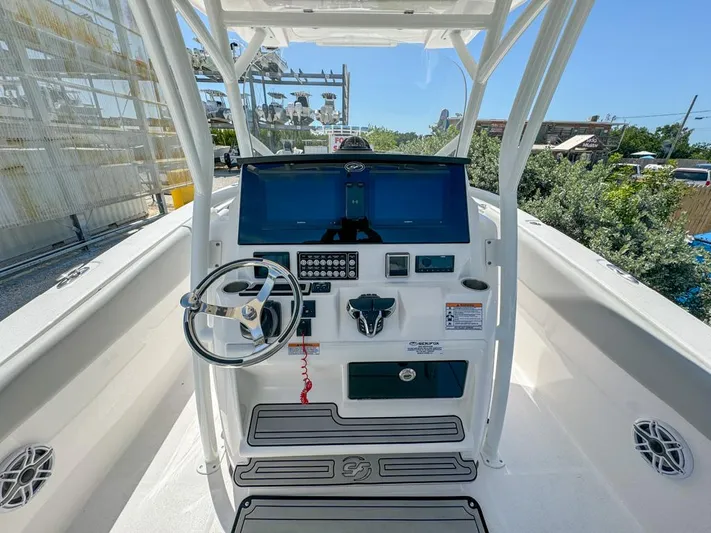  Yacht Photos Pics 2024 Sea Fox 288 Commander boat helm with dual screens and steering wheel.
