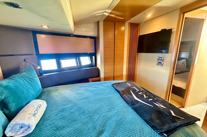  Yacht Photos Pics Luxurious bedroom interior of 2011 Azimut Fly 53 yacht with modern decor and amenities.