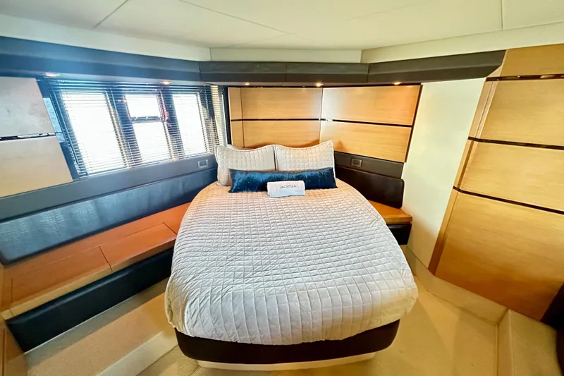  Yacht Photos Pics Luxurious bedroom interior of 2011 Azimut Fly 53 yacht with modern design elements.