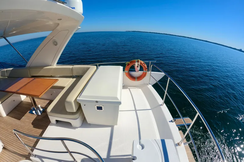  Yacht Photos Pics Luxurious 2011 Azimut Fly 53 yacht deck with ocean view and seating area.