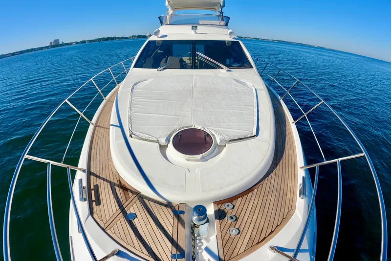  Yacht Photos Pics 2011 Azimut Fly 53 yacht on calm blue waters, showcasing sleek design and spacious deck.