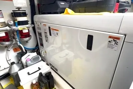  Yacht Photos Pics Engine room of 2011 Azimut Fly 53 yacht with Kohler generator and maintenance supplies.