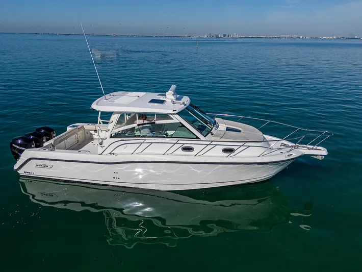  Yacht Photos Pics 2017 Boston Whaler 345 Conquest boat on calm blue water.