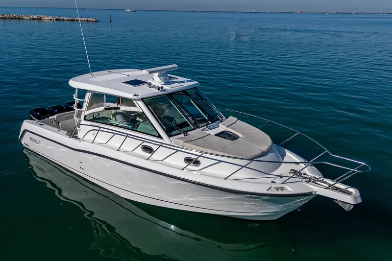  Yacht Photos Pics 2017 Boston Whaler 345 Conquest boat on calm blue water.