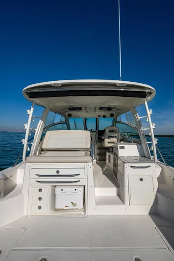  Yacht Photos Pics 2017 Boston Whaler 345 Conquest boat on open water, showcasing spacious deck and seating area.