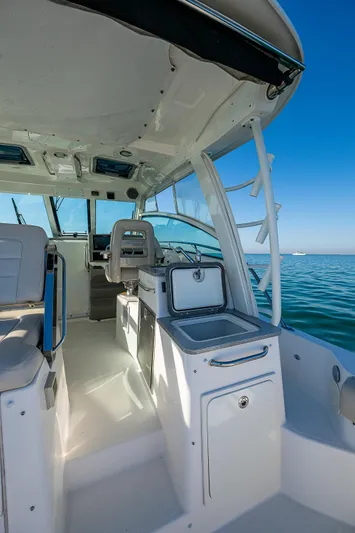  Yacht Photos Pics 2017 Boston Whaler 345 Conquest interior with seating and ocean view.