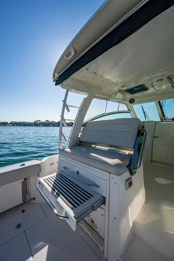  Yacht Photos Pics 2017 Boston Whaler 345 Conquest boat interior with seating and ocean view.