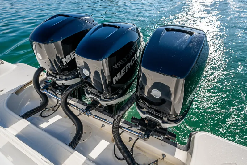  Yacht Photos Pics Triple Mercury outboard engines on a 2017 Boston Whaler 345 Conquest in clear water.