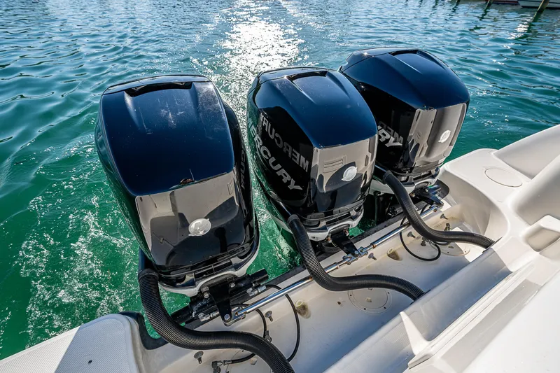  Yacht Photos Pics Triple Mercury outboard engines on a 2017 Boston Whaler 345 Conquest in clear water.