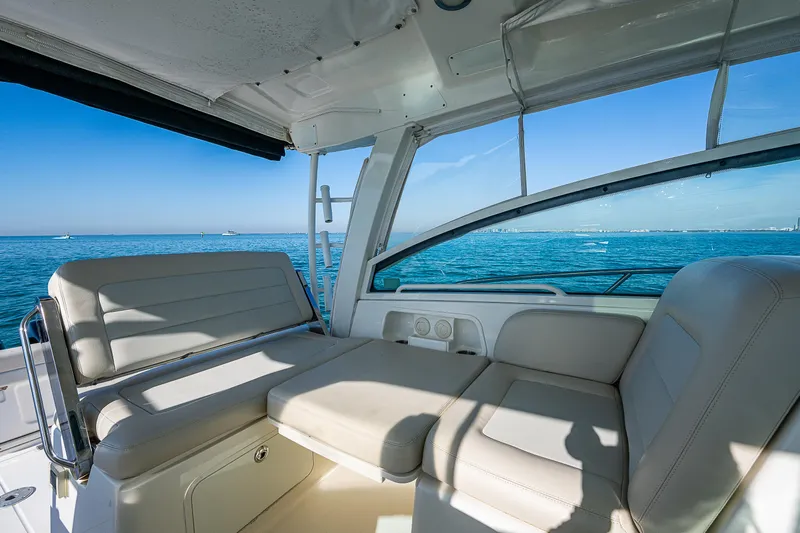  Yacht Photos Pics 2017 Boston Whaler 345 Conquest interior with ocean view, featuring comfortable seating.