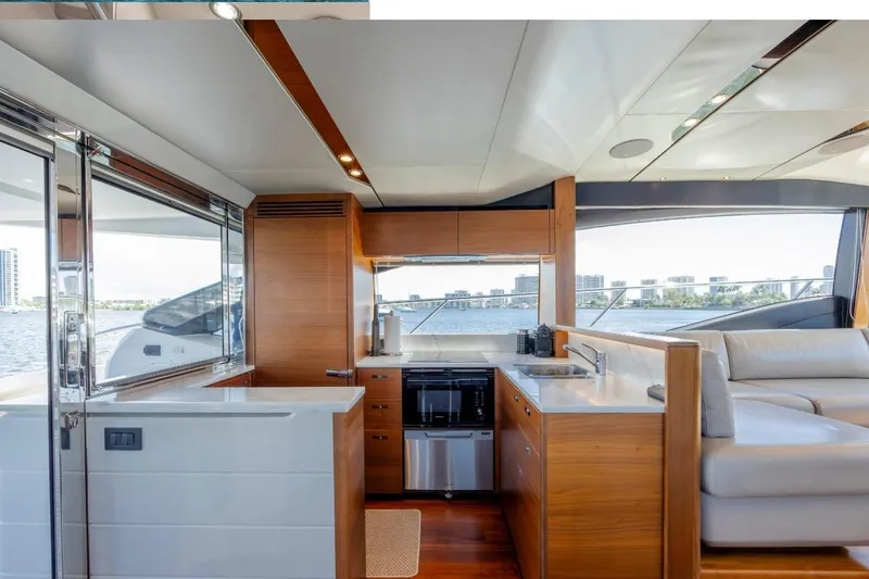  Yacht Photos Pics Luxurious interior of 2017 Princess S65 yacht with modern kitchen and scenic water views.