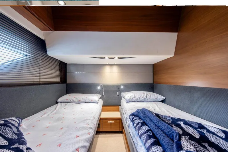  Yacht Photos Pics Luxurious 2017 Princess S65 yacht cabin with twin beds and modern decor.
