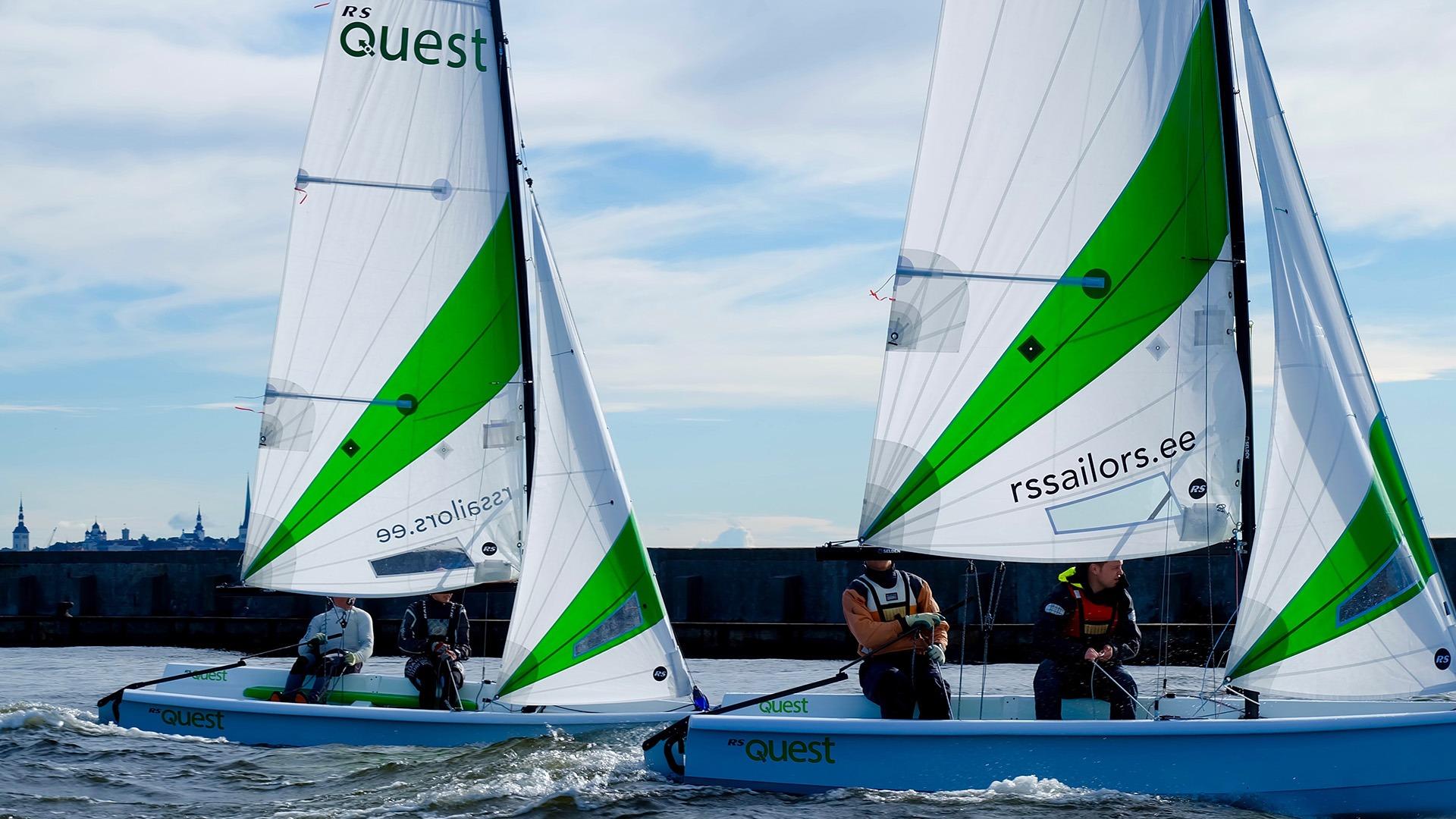 Two RS Quest sailboats racing on open water, 2025 model.