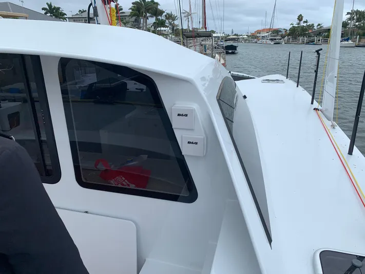  Yacht Photos Pics 2024 Schionning Arrow 1280 S catamaran docked at marina.